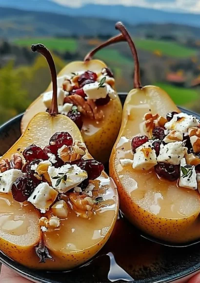 Baked pears with feta cheese, drizzled with honey and topped with cranberries