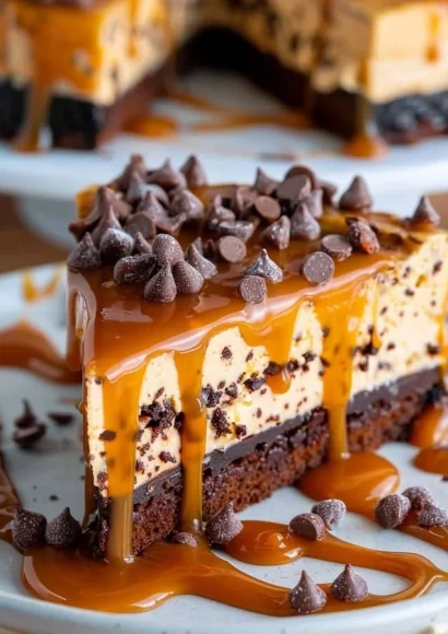 Caramel brownie cheesecake topped with drizzled caramel sauce