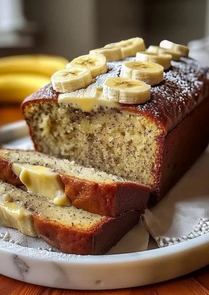 Slice of cream cheese banana bread on a wooden table