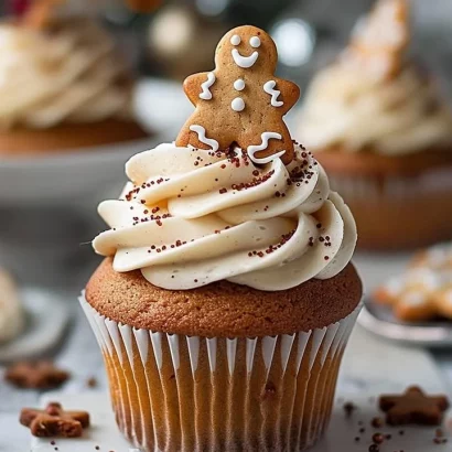 Delicious gingerbread cupcakes topped with creamy frosting and festive decorations