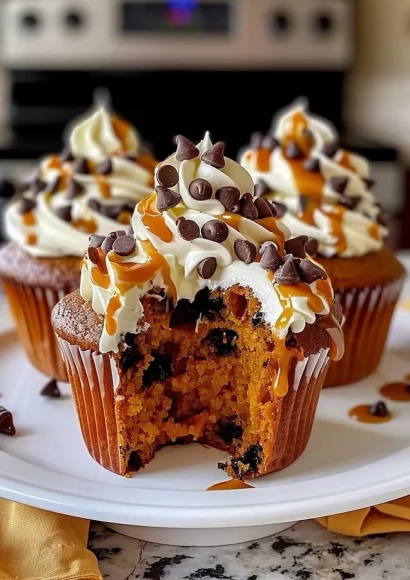 Pumpkin chocolate chip cupcakes decorated with buttercream frosting