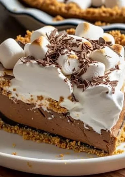 Delicious S'mores Cream Pie with chocolate, marshmallows, and graham cracker crust